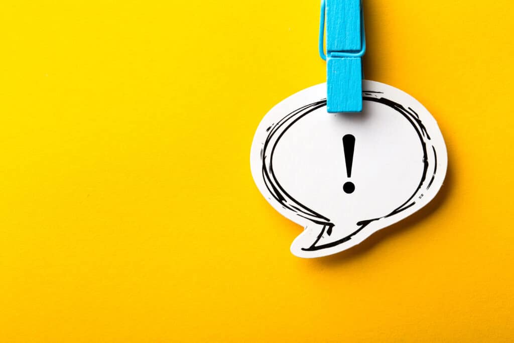 Exclamation mark speech bubble concept